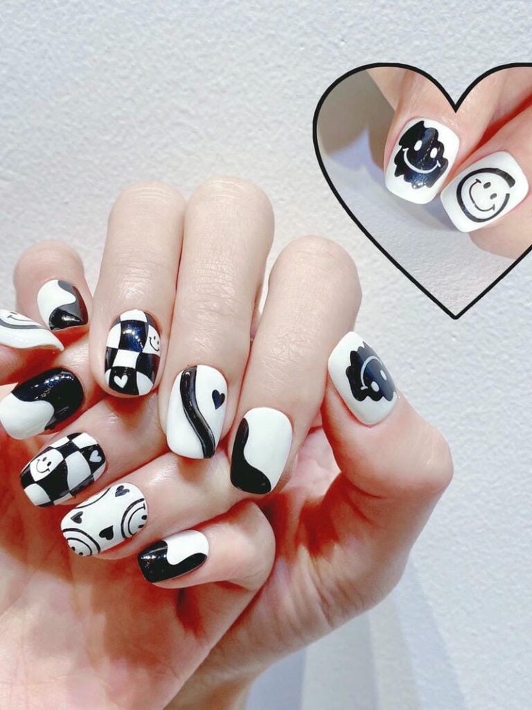 Mẫu nail mặt cười đẹp, dễ thương: Gợi ý hot trend năm 2025 Mau Nail Mat Cuoi Tone Den Trang Ca Tinh 768x1024
