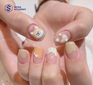 Kiểu vẽ móng tay hình cún con đáng yêu và năng động với nền móng sáng màu