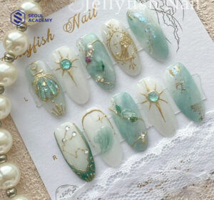 Mẫu móng tay màu xanh ngọc phong cách biển