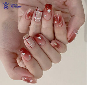 Mẫu nail ombre màu đỏ mận kết hợp đính đá sang chảnh, tạo hiệu ứng chuyển màu tinh tế
