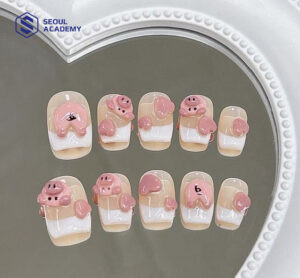 Mẫu vẽ móng tay hình thú thu hút với chú heo con màu hồng đáng yêu