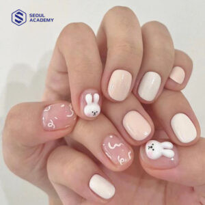 Mẫu vẽ móng tay hình thú với hình ảnh con thỏ trắng tinh khôi và màu sơn pastel
