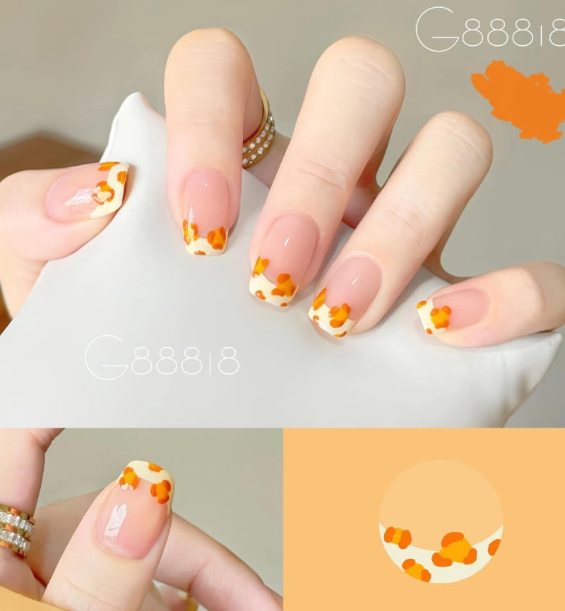 Móng tay màu cam đáng yêu với họa tiết hoạt hình