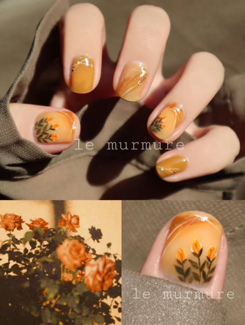 Móng tay màu cam vẽ họa tiết dễ thương