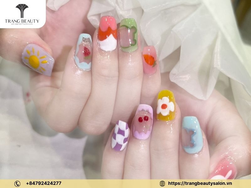 Móng tay vẽ hoa tuyết pastel thanh lịch trên nền tím hồng