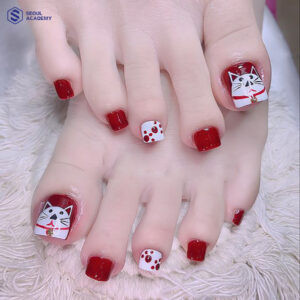 Nail vẽ mèo thần tài dành cho Tết với tone đỏ